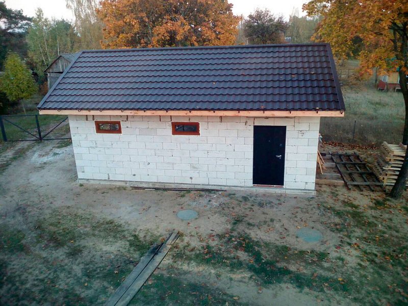 Вентфасад гаража из фасадной доски ДПК Outdoor